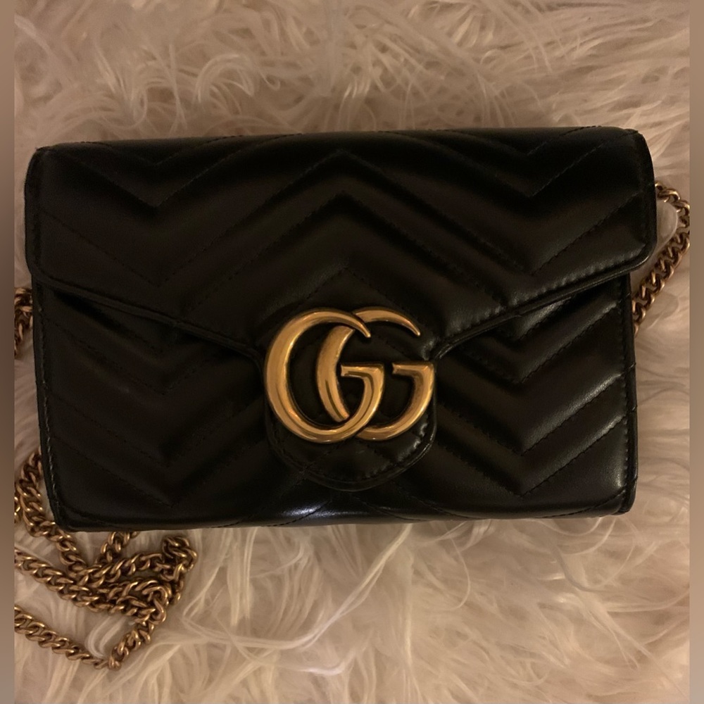 Gucci GG Matelasse’ leather wallet on a chain.